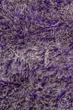 closeup of the texture of a purple rug