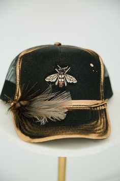 GOLDEN BEE BLACK TRUCKER HAT TRUCKER HAT Judith March Women’s Trucker Hat Outfit, Trucker Hat Outfit, Black And White Feather, Indian Hat, Hat Bar, Black Trucker Hat, Cowboys And Indians, Unique Hats, Gold Bee