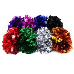 multicolored pom poms on white background