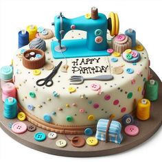 a birthday cake decorated with buttons and sewing supplies