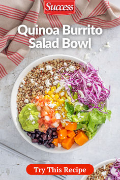 a bowl filled with salad and topped with lettuce, carrots, red cabbage, black beans and other veggies