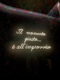 a neon sign that says it's moments gusto e all imppooniios