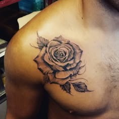 a man with a rose tattoo on his chest