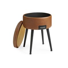 the stool is made out of wood and has an oval seat with legs on it