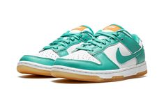 The Women’s Nike Dunk Low “Teal Zeal” is a women’s-exclusive colorway of the vintage basketball and lifestyle shoe that was released in July 2022.  A summer-ready colorway, the “Teal Zeal” features an appealing combination of white leather on its base, and Teal Zeal-colored leather on its overlays and Swoosh branding.  A white “Nike” logo is embroidered on the heel.  An orange tongue tag with “Nike Dunk” branding contrasts the look of the white tongue.  Teal Zeal laces continue the shoe’s bold s Womens Dunk Low, Nike Dunk Lows, White Tongue, Teal Nikes, Dunk Lows, Low Dunks, July 2022, Stadium Goods, White Turquoise