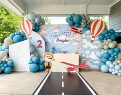 an airplane themed birthday party with balloons and decorations