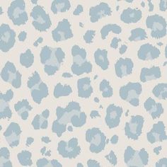 a blue and white animal print wallpaper with spots on the back side of it