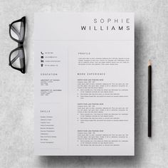 a clean and modern resume template with an eyeglass on the table next to it