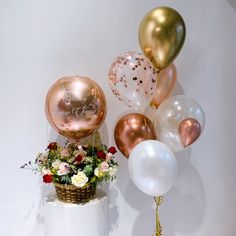 some balloons and flowers on a table