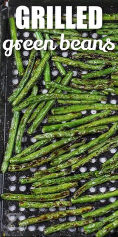 grilled green beans on a grill with text overlay that reads grilled green beans