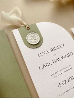 a wedding card with a wax seal on it