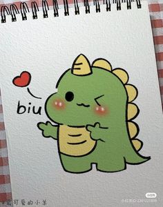 a drawing of a little green dinosaur holding a red heart with the words biu written on it