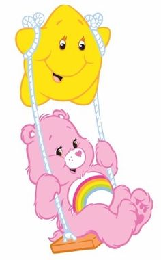 a pink teddy bear on a swing with a smiling yellow smiley face hanging from it's back