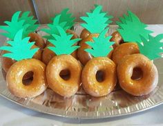 there are many doughnuts with pineapple decorations on the top one is made to look like pineapples