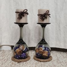 two wine bottles with corks in them sitting next to each other