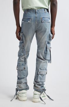 When it comes to combining beloved denim with the cargo comeback, Amiri completes the mission with pocket-popped jeans cut with plenty of stretch. 33 1/2" inseam; 15" leg opening; 11" front rise; 14" back rise (size 32) Button fly Front patch pockets; cargo snap-flap pockets; cargo zip pocket Drawstring hems 92% cotton, 6% elastomultiester, 2% elastane Dry clean Made in the USA Designer Clothing The Mission, Cargo Jeans, Flap Pocket, Cargo Pants, Zip Pockets, Designer Clothing, Dry Clean, Things To Come, Clothes Design