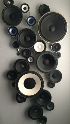 many speakers are hanging on the wall