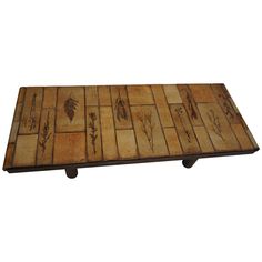 a wooden table with leaves on it