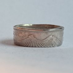 Genuine SILVER ring made with a vintage Coin from Ireland.  Ring features image of a Harp. Rings are sized to order. Please check your ring size before ordering. Please message us for custom rings before placing an order. Other sizing available upon request. Since we use genuine foreign coins necklaces may vary slightly from the photo due to unique wear and aging, but it will still be a close match. Whether this purchase is to help you connect to your roots, keep a precious dream or memory alive, or to remind you of a loved one we are glad to be a part of your journey! Check out our full collection of foreign coin jewelry and accessories in our shop! Find us on Facebook and Instagram @lostcoinjewelryco Orders are usually shipped in 1-3 business days. Vintage Silver Coin Jewelry, Antique Silver Symbolic Nickel-free Rings, Antique Coin-shaped Sterling Silver Jewelry, Irish Harp, Silver Coin Ring, Foreign Coins, Antique Finish Coin-shaped Jewelry Gift, Coin Ring, Coin Jewelry