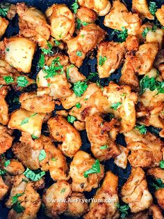 chicken wings with parsley in a skillet ready to be cooked and served for dinner