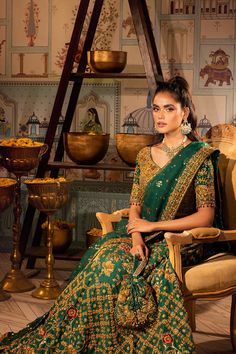 Emerald Green Lehenga Choli Pakistani Mehndi Dresses come in lehenga and choli with a raw silk fabric lehenga base paired with net chiffon embellished dupatta completed with a pouch. Bridal Choli: Pakistani Mehndi Dresses is an astonishing emerald green heavily embellished choli on pure raw silk contrasted with hand work in gold color. It has details of hanging beads and is paired with pure raw silk lehenga filled with silk threaded rosettes and details of heavily crafted handwork on borders. Gr Emerald Green Lehenga, Lehenga Choli Pakistani, Bridal Choli, Ansab Jahangir, Pakistani Mehndi Dress, Green Lehenga Choli, Pakistani Mehndi, Mehndi Dresses, Raw Silk Lehenga