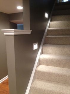 an empty room with stairs leading up to the second floor