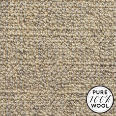 a close up view of a carpet with the words pure wool written in white on it