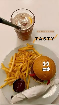 a hamburger and fries on a plate with ketchup