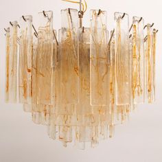 The absolutely fantastic vintage Murano glass large chandelier made in Italy in the 1970s. This lamp has 5 rings that overlap beautifully. The lamp consists of glass plates of Murano glass, you can view the glass from 2 sides, there is a beautiful amber color garland running over the glass, made by Italian glassblowers. They follow the oldest Murano glass making technologies invented on the island of Murano. Each pendant is unique as it is handmade. Chandelier in excellent vintage condition. Tot Murano Lamp, Handmade Chandelier, Large Chandelier, Glass Making, Murano Glass Chandelier, Glass Pendant Lamp, 5 Rings, Large Chandeliers, Candle Lamp