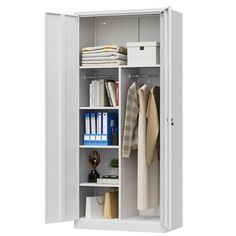 an open white cabinet with clothes and books