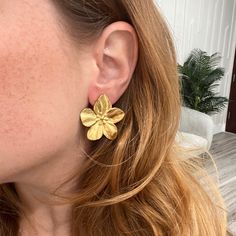 Experience the beauty of nature with our Darla Flower Earrings. These earrings are the perfect way to add a touch of elegance and femininity to any outfit. Handcrafted with love and attention, these earrings will surely make a statement. 18k Gold Plated over Stainless Steel 1.3" Water & Tarnish Resistant Hypoallergenic Chic Petal-shaped Earrings For Gift, Feminine Gold Petal Earrings, Elegant Yellow Gold Birth Flower Earrings, Gold Flower Earrings, Nature-inspired, Nature-inspired Earrings For Anniversary, Nature-inspired Gold Flower Earrings, Gold Nature-inspired Earrings With Flower Charm, Gold Flower Earrings As Gift, Nature-inspired Gold Earrings With Flower Charm