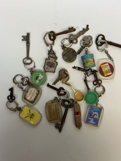 a bunch of keys that are laying on top of each other in different shapes and sizes