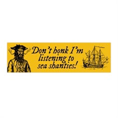 a yellow bumper sticker with an image of a pirate ship and the words don't book i'm listening to sea shanties