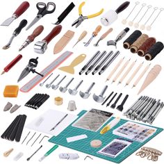 an assortment of crafting tools are displayed on a white background