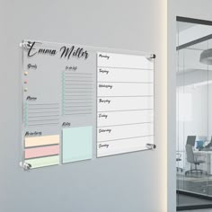 an office with a glass door and whiteboard on the wall that says e - name waters