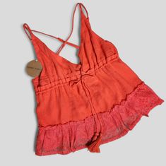 Honey Punch Coral, Red Adjustable Strappy Double Straps V-Neck Flattering Adjustable Tie This Top Is A Definite Must-Have To Add To Your Closet This Summer Measurements: Pit 19" Length 22" Chic Red Loungewear Top, Cotton V-neck Beachwear Tops, Red Summer Loungewear Tops, Red Tops For Summer Loungewear, Spring Beachwear Cami Tops, V-neck Beachwear Top For Loungewear, Red V-neck Tops For Beach Season, Red V-neck Top For Beach Season, Spring Beachwear V-neck Tops