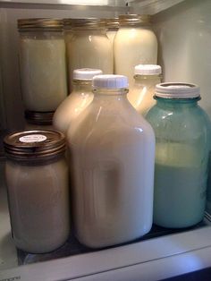 there are many different types of milk in the refrigerator