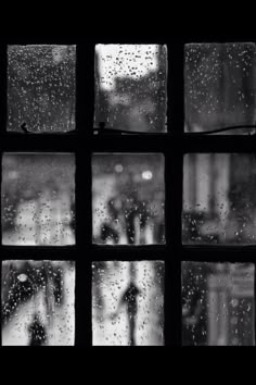 black and white photo of rain outside window