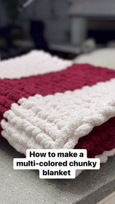 a red and white blanket sitting on top of a counter