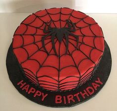 a spiderman birthday cake on a table