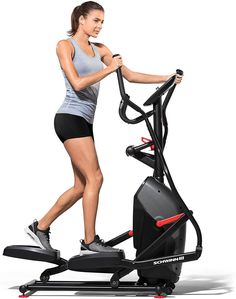 a woman is running on an exercise bike