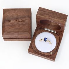 Each piece of Lilia Nash jewellery is presented in a high quality card box, but why not upgrade to one of our luxury eco ring boxes for an extra special touch? Handmade from solid walnut and sourced from sustainable forests in New Zealand and managed to ensure the balance and biodiversity of the surrounding area is maintained, each box is masterfully crafted from a single piece of timber, so both parts are a lovely, continuous match. Each box is supplied with an information card. Please note tha Australian Sapphire, Trilogy Engagement Ring, Birthstone Stacking Rings, How To Wear Rings, Sapphire Solitaire Ring, Plus Size Rings, Gold Solitaire Engagement Ring, Wooden Ring Box, Paper Ring