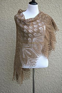 Hand knit shawl. 100% wool in beige (slightly heather shade) color. It is very laced and delicate and yet warm an cozy. Simple flower ornament adds a romantic look to the s... #kgthreads Elegant Alpaca Shawl, Elegant Hand Knitted Cream Shawl, Elegant Handmade Shawl As Gift, Elegant Handmade Shawl For Gift, Elegant Hand Knitted Alpaca Shawl, Elegant Alpaca Shawl Scarf, Hand Knitted Alpaca Shawl, Elegant Handmade Shawl Wrap, Beige Bohemian Shawl For Wedding