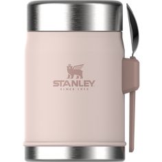 a pink stainless steel coffee mug with a spoon in the cup and stanley logo on it