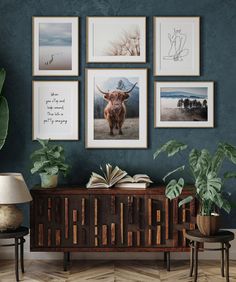 a living room with blue walls and pictures hanging on the wall, including a cow's head