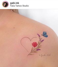 the back of a woman's shoulder with flowers and butterflies on her left side