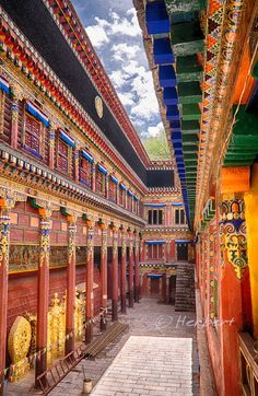 the inside of an old building with colorful decorations on it's walls and ceiling