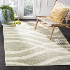 a living room area with a chair and rug