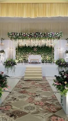 an aisle decorated with flowers and greenery