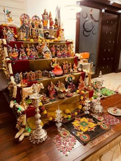 a display case filled with lots of different types of figurines on top of a wooden table